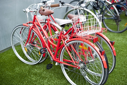 Pair of Red Bicycles with White Baskets