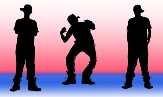 silhouettes of breakdancers